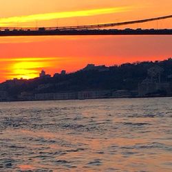 Scenic view of river at sunset