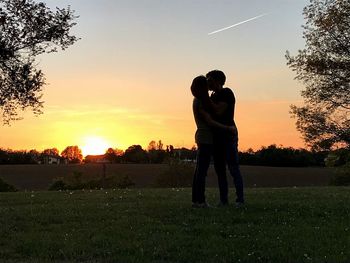 Silhouette of man on golf course