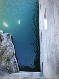 High angle view of rocks by sea