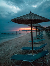 Scenic view of beach against sky during sunset