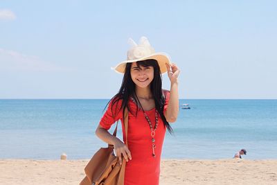 High angle view of woman standing on beach