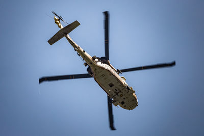 Low angle view of helicopter toy against clear sky