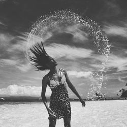 Woman tossing wet hair
