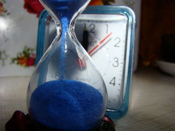 Close-up of clock on table