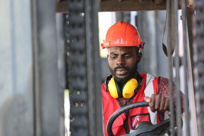 Portrait of man working in factory