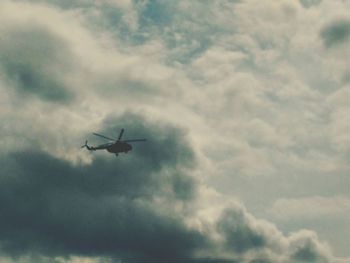 Low angle view of airplane flying in sky