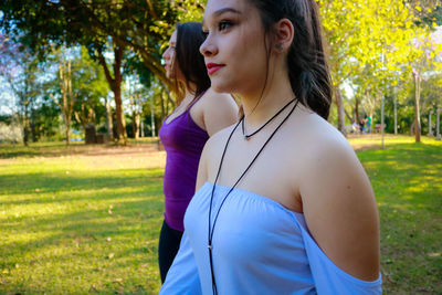 Close-up of beautiful woman standing in park