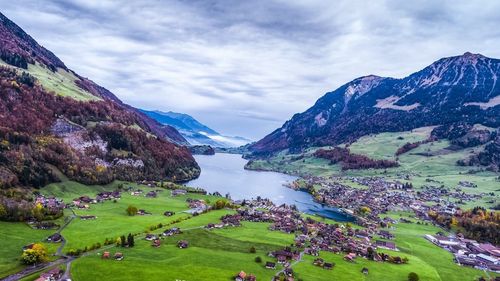 Scenic view of lake against cloudy sky