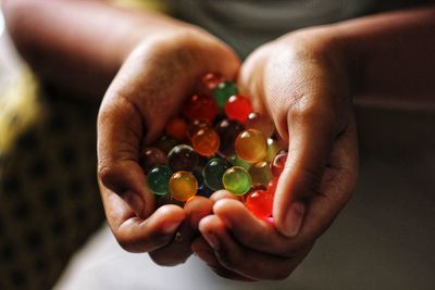 Cropped hand of woman holding pills