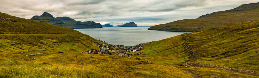 Scenic view of landscape and mountains against sky