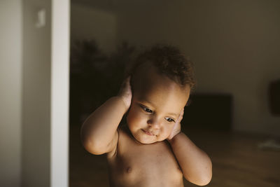 Toddler covering ears