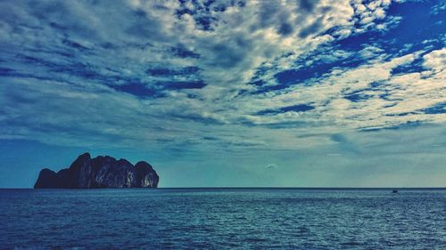 Scenic view of sea against cloudy sky