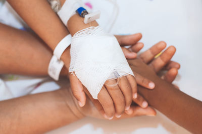 Close-up of children hands with patient stacking in hospital