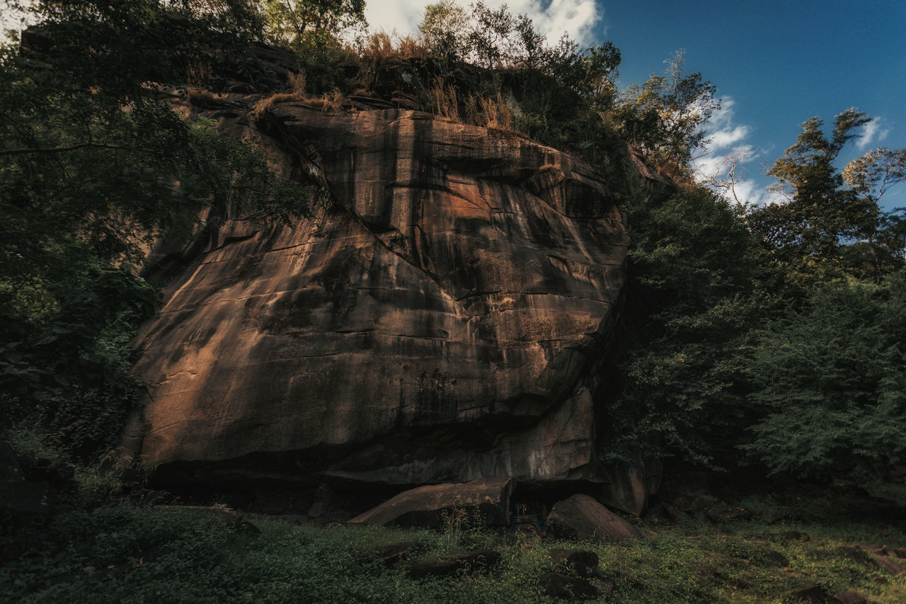 LOW ANGLE VIEW OF ROCK FORMATION AGAINST SKY