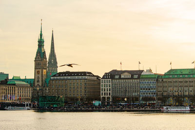 Buildings against sky at sunset