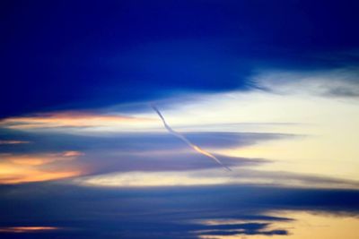 Low angle view of vapor trails in sky