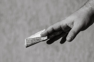 Cropped image of man holding key