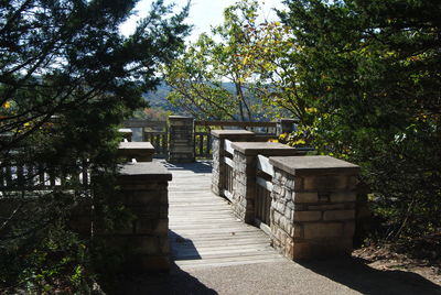 Gazebo amidst trees against sky