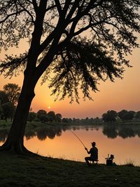 Silhouette people in park during sunset