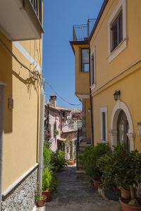 Narrow alley amidst buildings in city