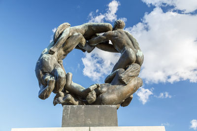 Low angle view of statue against sky