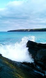 Scenic view of sea against cloudy sky