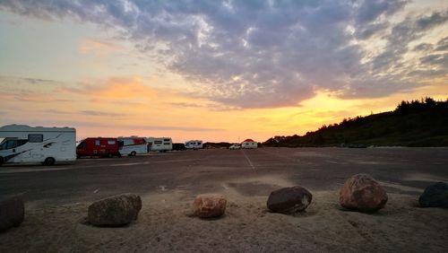 Scenic view of beach against sky during sunset