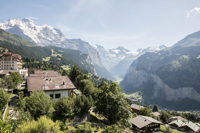 Panoramic view of buildings and mountains against sky