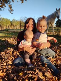 Portrait of happy friends on field