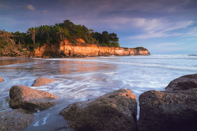 The view of the rocky beach on a sunny day