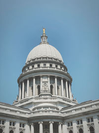 Low angle view of building against clear blue sky