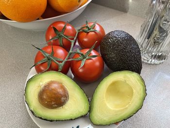 Avocado and tomatoes on the vine, source of energy and vitality, healthy life