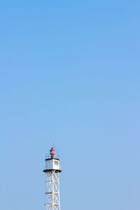 Low angle view of tower against clear blue sky