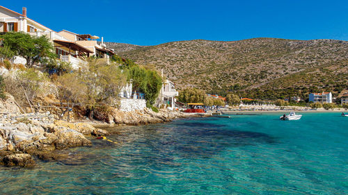 Scenic view of sea against clear blue sky