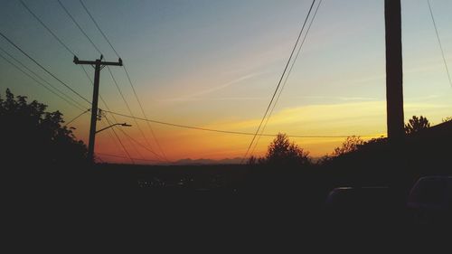 Electricity pylons at sunset