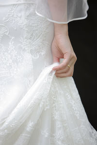 Midsection of wedding dress
