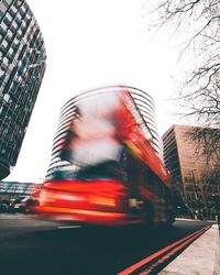 Blurred motion of city buildings against sky