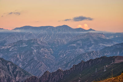 Scenic view of mountains against sky during sunset