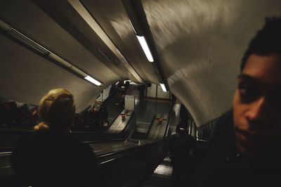 Rear view of people at subway station