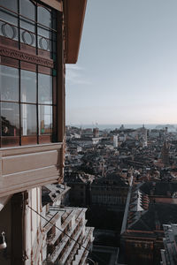 Buildings in city against clear sky