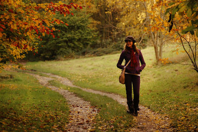 Full length of woman standing on field