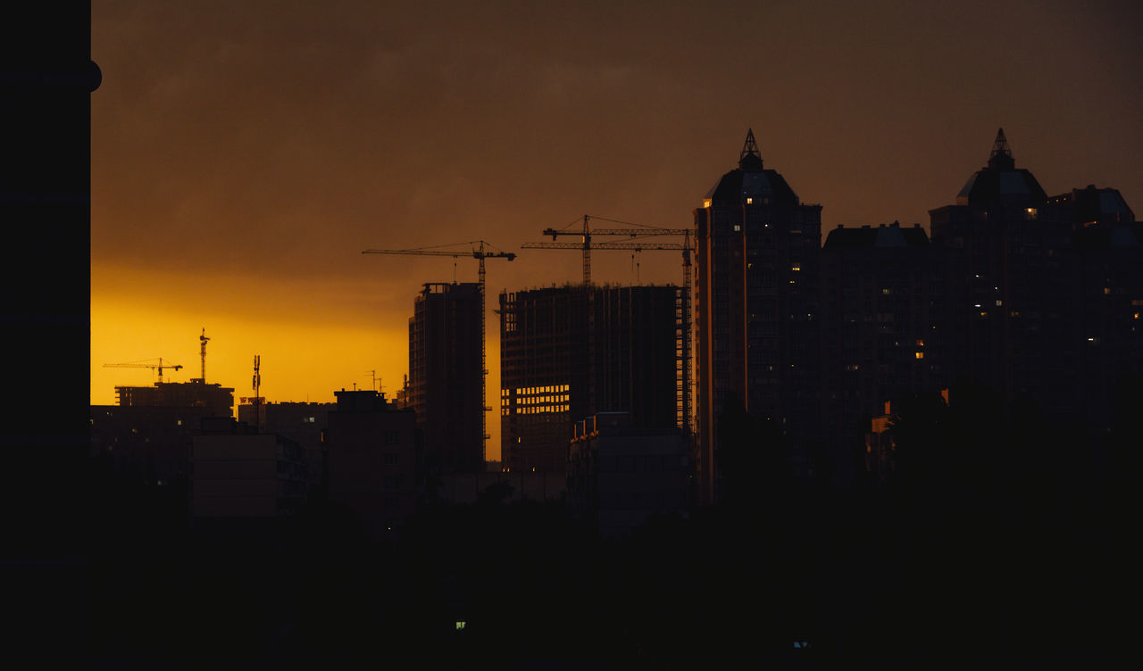 SILHOUETTE BUILDINGS IN CITY DURING SUNSET