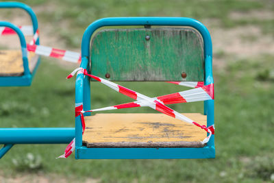 Close-up of empty swing in park