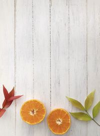 Directly above shot of orange fruits on table