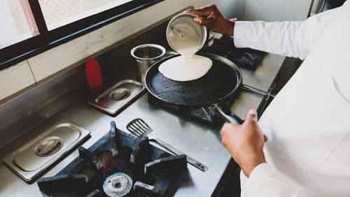 High angle view of man working on table