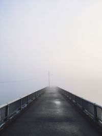 Empty pier in foggy weather