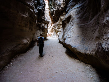 Rear view of man in tunnel