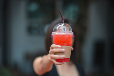 Close-up of woman hand holding drink