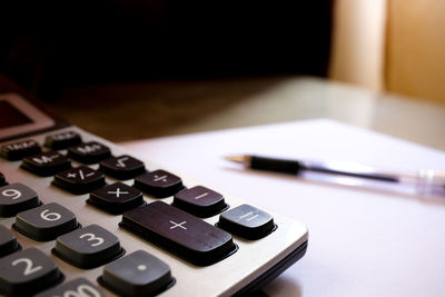 Close-up of calculator on table