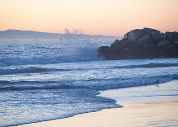 Scenic view of sea against sky during sunset